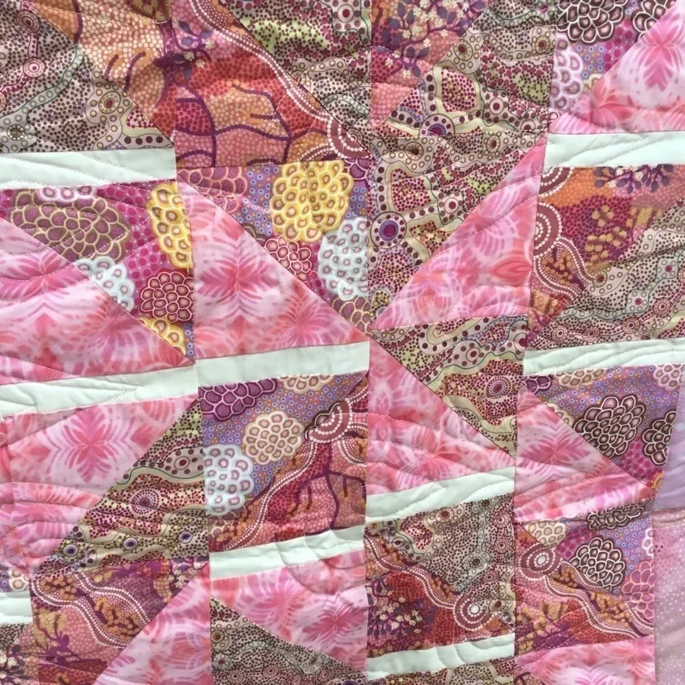 NWT. Hand Crafted Pinks Aboriginal Prints Quilt